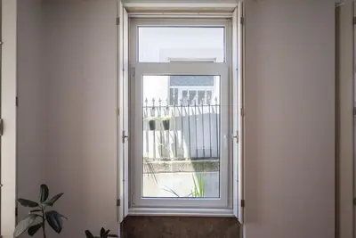 an open window with a view of a balcony at Casa B in Porto