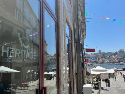 a view of a street with people walking down the street at VC Heritage Ribeira Porto in Porto