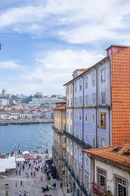 a group of buildings next to a body of water at VC Heritage Ribeira Porto in Porto