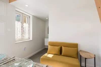 a small bedroom with a bed and a desk at Beco do Paço by Porto Dream Stays in Porto