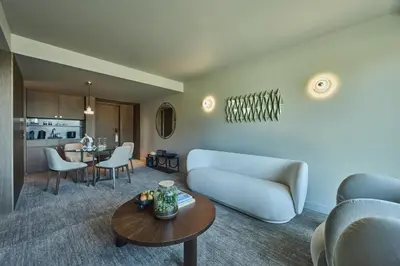 a living room with a couch and a table at Altis Porto Hotel, a member of Preferred Hotels & Resorts- LVX in Porto