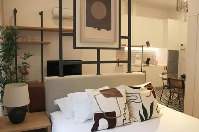 a bedroom with a bed with pillows on it at Modern Flat Near Trindade by LovelyStay in Porto