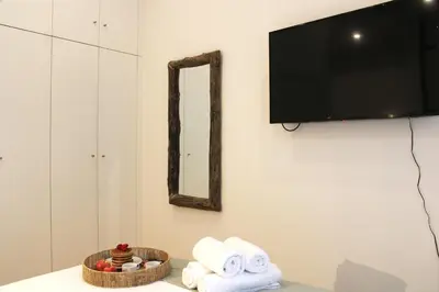 a room with towels and a mirror on the wall at Modern Flat Near Trindade by LovelyStay in Porto