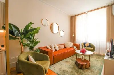 a living room with a couch and two chairs and a table at Luxurious Flat in City Center by LovelyStay in Porto