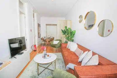 a living room with a couch and a table at Luxurious Flat in City Center by LovelyStay in Porto