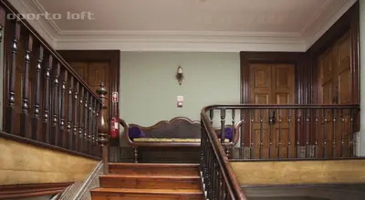 a staircase in a house with a couch on it at Oporto Loft in Porto