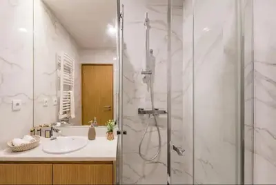a bathroom with a shower and a sink at ApartmentsPorto - Leisure Fun Apartment in Porto