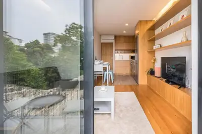a living room with a view of a kitchen at ApartmentsPorto - Leisure Fun Apartment in Porto
