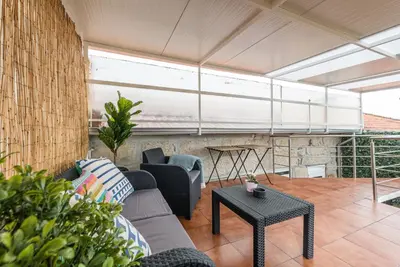 a living room with a couch and a table at GuestReady - Cosy getaway in Porto in Vila Nova de Gaia