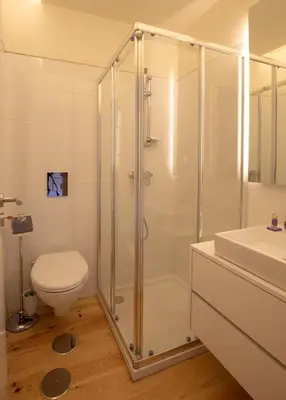 a bathroom with a shower and a toilet and a sink at GuestReady - Catorze de Outubro Houses 427 in Vila Nova de Gaia