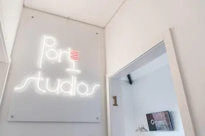a white room with a sign on the wall at GuestReady - Port Studio 1 in Vila Nova de Gaia