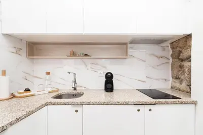 a kitchen with a sink and a counter top at Lady Lapa by Lady Collection in Porto
