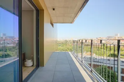 an empty balcony with a view of a city at Brand New Luxurious Ap T2 - Amazing View- with garage in Vila Nova de Gaia
