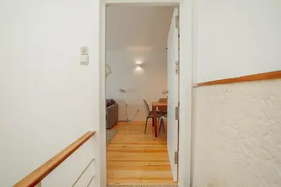 a hallway with a door leading to a dining room at Porto Panoramic Views With Terrace by Vacationy in Porto