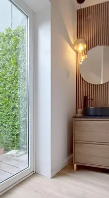 a room with a window and a dresser and a mirror at Oporto Nura Apartment Downtown in Porto