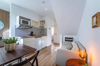 a living room with a white couch and a table at Oporto Nura Apartment Downtown in Porto