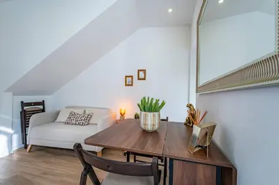 a living room with a table and a couch at Oporto Nura Apartment Downtown in Porto