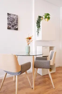 a dining room with a table and two chairs at C&P Bolhão Downtown Studio in Porto