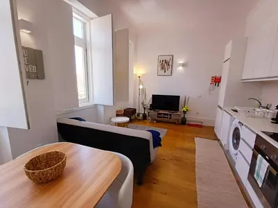 a living room with a couch and a table at Foryou-2-BonfimPorto in Porto