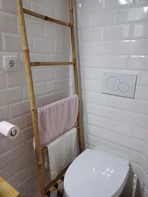a bathroom with a white toilet and a towel at Foryou-2-BonfimPorto in Porto