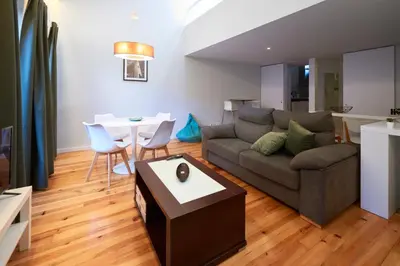 a living room with a couch and a table at Dux in Porto