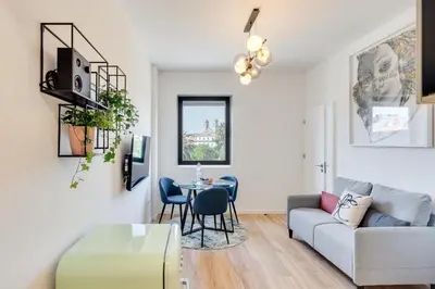 a living room with a couch and a table at Rola Art Work Studio II by DA'HOME in Porto