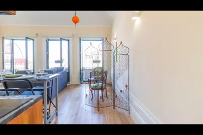 a kitchen and dining room with a wrought iron gate at AM Haven Studios - by Unique Hosts in Porto