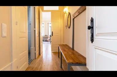 a hallway with a wooden bench in a room at AM Haven Studios - by Unique Hosts in Porto