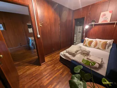 a bedroom with a bed on a boat at Travel and Live Poveiros in Porto