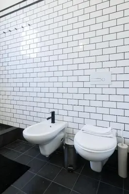 a bathroom with a toilet and a bidet at Baixa24 · City Center Private Sun Deck Apartment in Porto