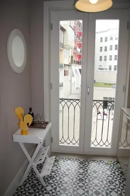 a room with a door leading to a balcony at Toctoc Yellow in Porto