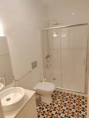 a bathroom with a toilet and a sink and a shower at Premium Apartment Porto Downtown - Bonjardim in Porto