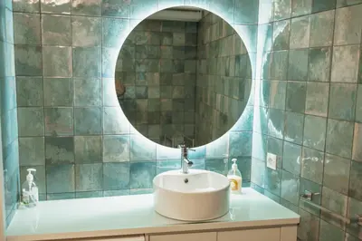a bathroom with a sink and a mirror at Clerigos Loft by Hosty in Porto