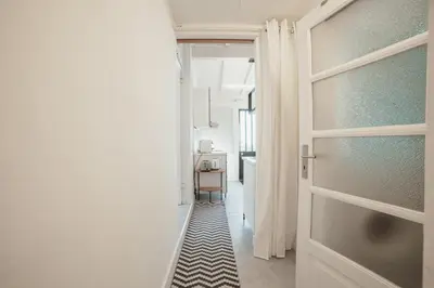 a door leading to a hallway with a table at Clerigos Loft by Hosty in Porto