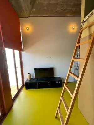a room with a bunk bed and a ladder at Porto Studio in Porto