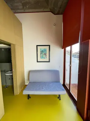 a room with a bed in the corner of a room at Porto Studio in Porto