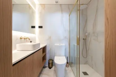 a bathroom with a toilet and a sink and a shower at Doispontozero Alegria Green in Porto