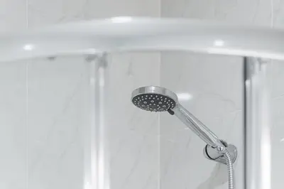 a shower with a shower head in a bathroom at GuestReady - Porto Saudade in Porto