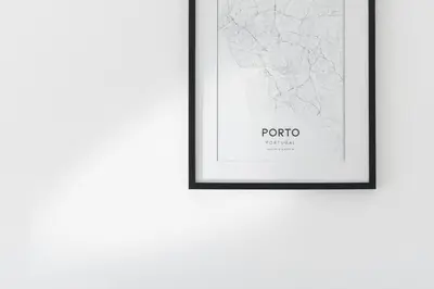 a framed map of porto on a white wall at GuestReady - Porto Saudade in Porto