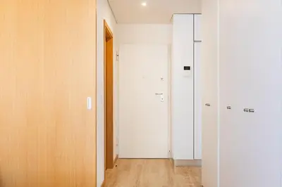 a screenshot of a red room with two signs at Duque de Saldanha Residences in Porto