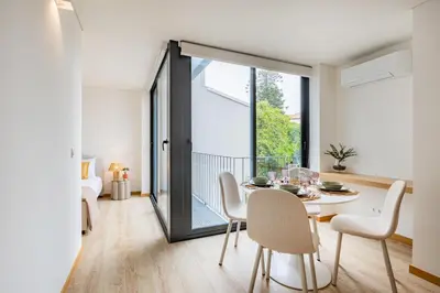 a living room with a couch and a table at Duque de Saldanha Residences in Porto