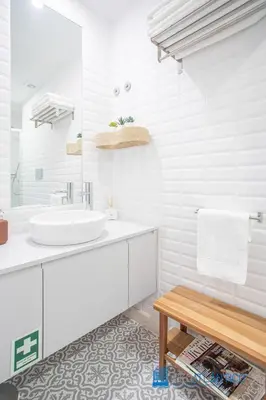 a white bathroom with a sink and a mirror at Boavista Central Garden & Terrace in Porto