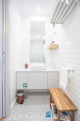 a white bathroom with a shower and a toilet at Boavista Central Garden & Terrace in Porto