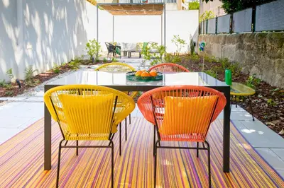 a living room with a couch and a table at Boavista Central Garden & Terrace in Porto