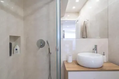 a bathroom with a sink and a shower at GuestReady - Stylish stay with balcony in Gaia in Vila Nova de Gaia