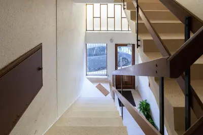 a staircase in a house with two windows at GuestReady - Stylish stay with balcony in Gaia in Vila Nova de Gaia