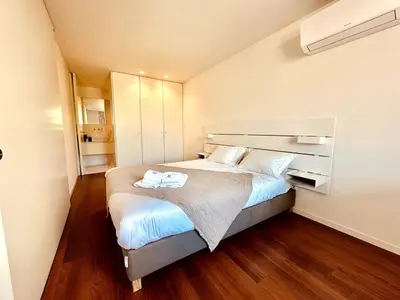 a bedroom with a bed with two towels on it at Bombarda 250 E in Porto