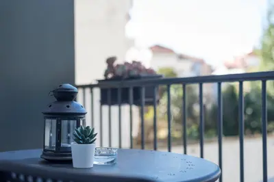 a lantern sitting on top of a table with a cactus at Apartment Alegria Street by Sweet Porto - Free Parking in Porto