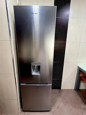 a stainless steel refrigerator in a kitchen at Douro Residence Porto Gaia in Vila Nova de Gaia