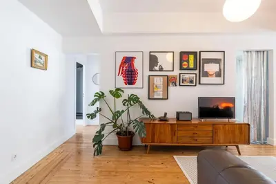 a living room with a tv and a couch at St Catarina 555 Apartment in Porto